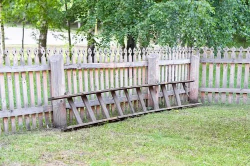 Cedar fence posts set in concrete footings at a Metro Vancouver property