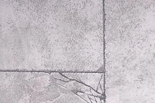 Concrete repair work restoring a cracked driveway surface in Metro Vancouver