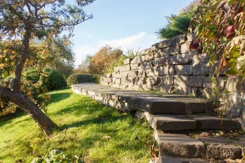 Engineered concrete retaining wall and steps built on a sloped Vancouver property